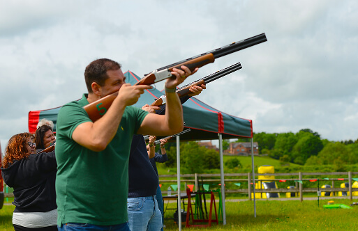 A man firing a laser clay shotgun at Adventure Sports