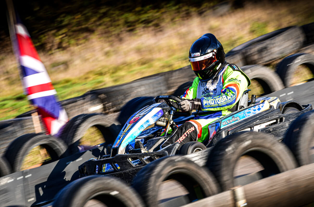 A group of women in a line, pulling back on a bow and arrow