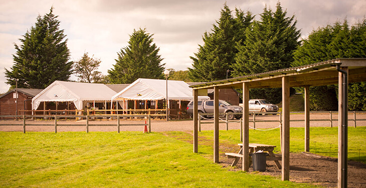 The seating area outside the clubhouse at Adventure Sports Warwick