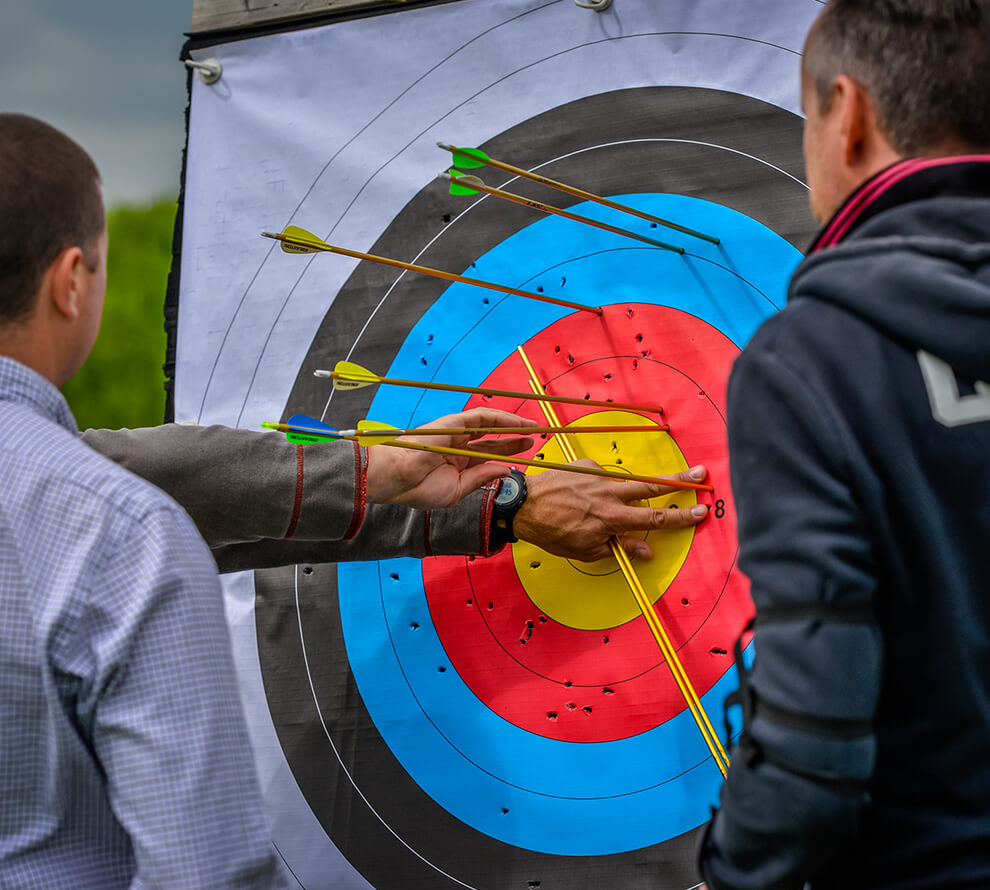 A group counting their scores on a target