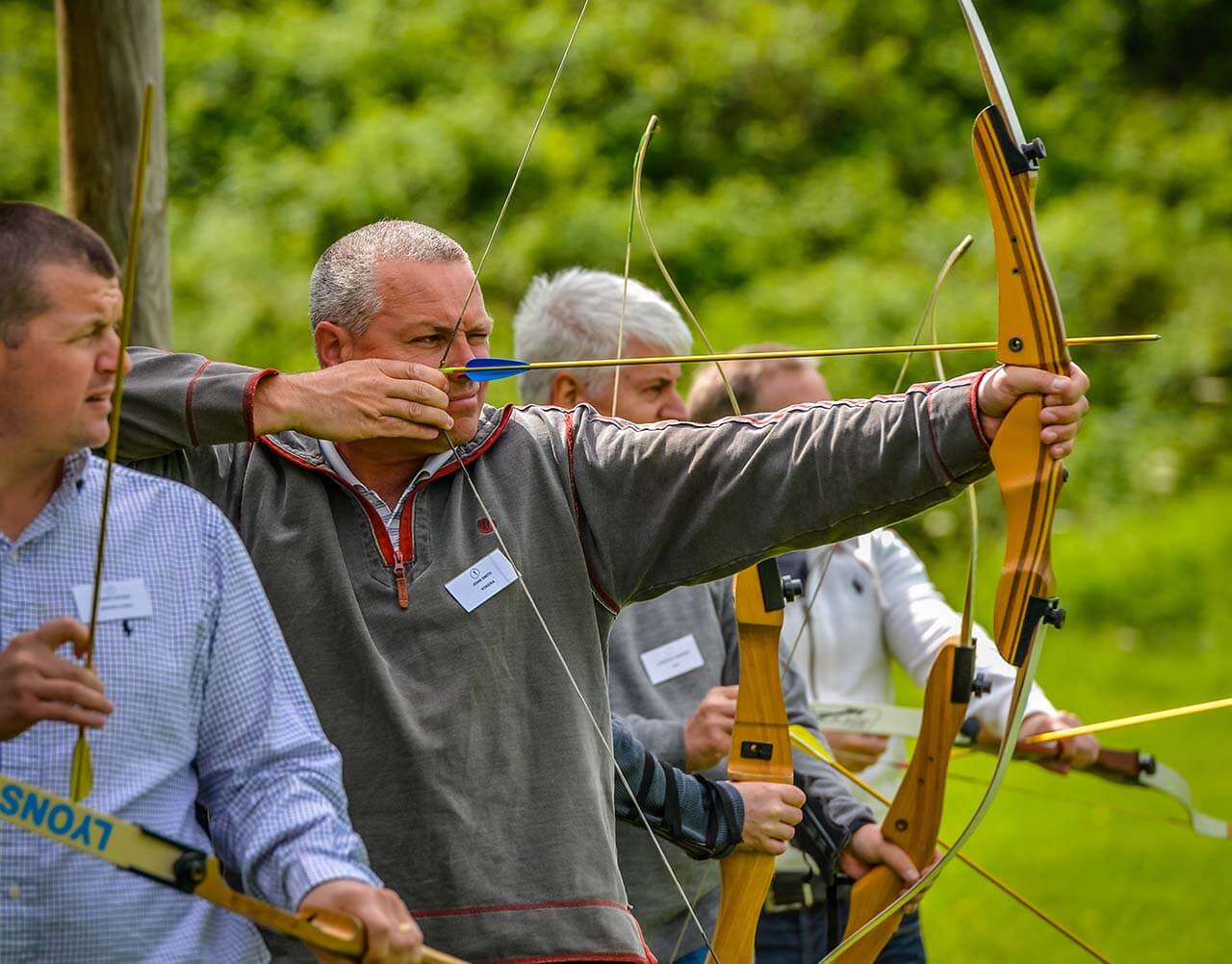 A man bulling back on a bow and arrow