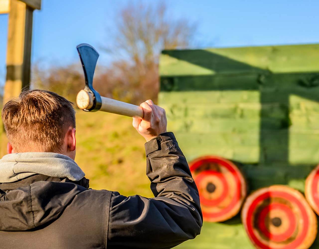 A man throwing an axe at a target