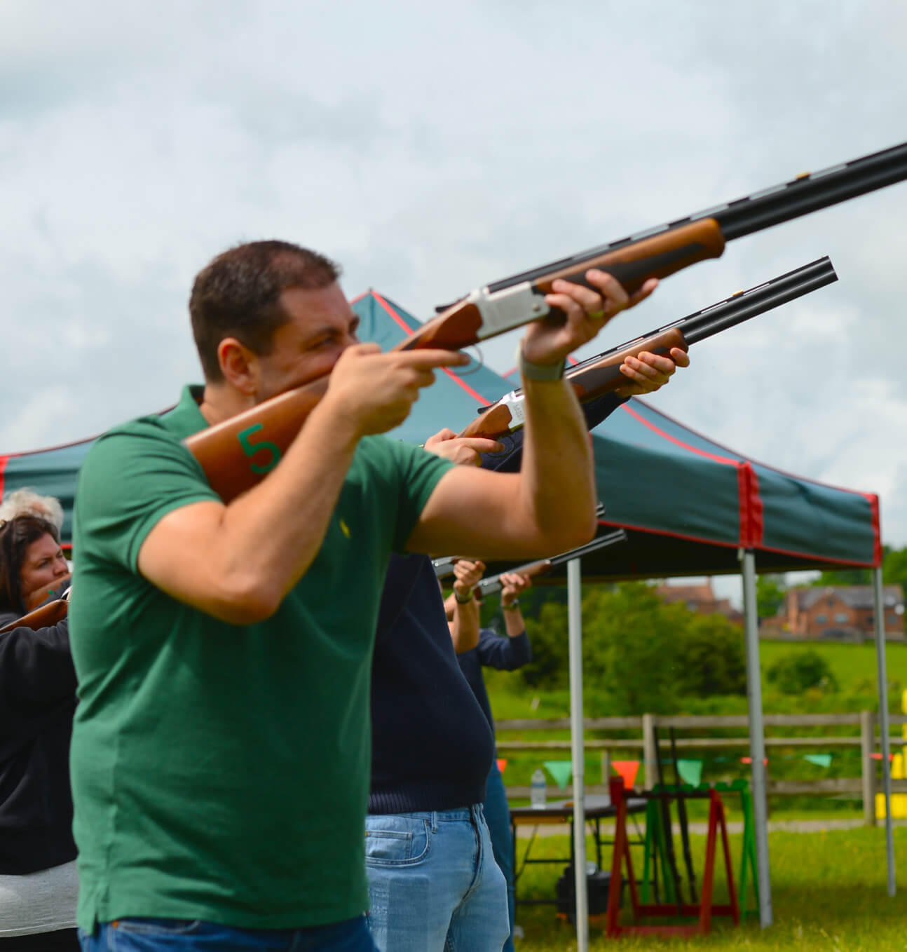 Close up image of a man with a laser clay shooting gun
