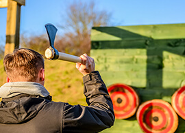 A man throwing an axe at a target