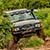 A 4x4 off road car driving on rough terrain