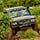 A 4x4 off road car driving on rough terrain