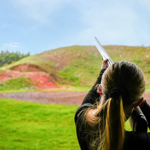 Participant clay shooting during a corporate team building activity at Adventure Sports in Warwick