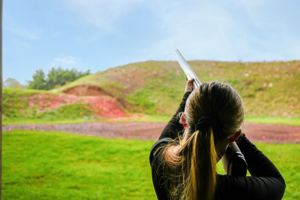 Participant clay shooting during a corporate team building activity at Adventure Sports in Warwick